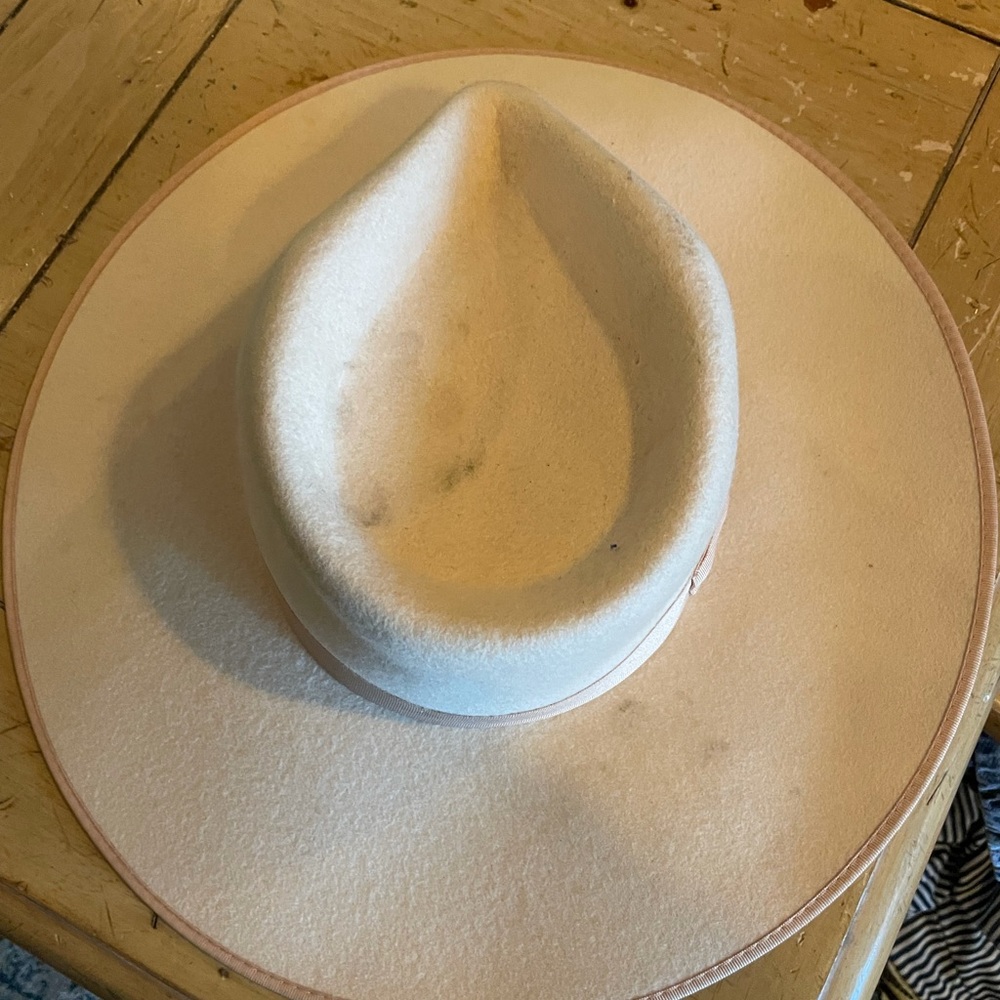 Worn too many times. I loved this hat. It was the perfect summer hat